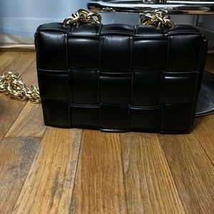 Black purse with gold chain